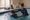 Swim instructor supports a child practicing in an indoor pool.
