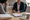 A clinician and patient review paperwork together at a desk in a medical office.