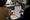 Two people review printed lab results together at a desk in a bright office.